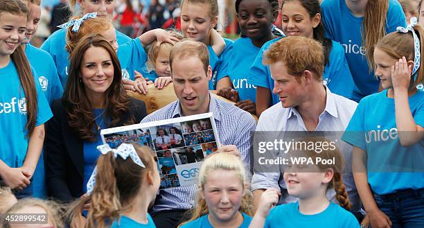 Prince William, Duke of Cambridge, Catherine, Duchess of Cambridge and Prince Harry during a visit to the Commonwealth Games Village on July 29, 2014...