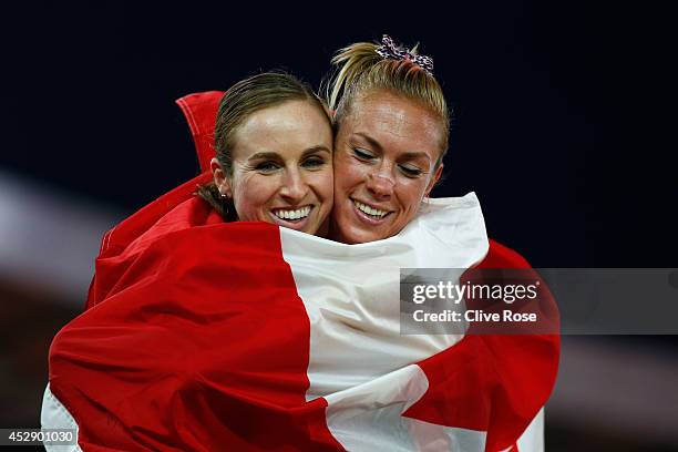 Bronze medalist Kate van Buskirk of Canada celebrates with Nicole Sifuentes of Canada after the Women's 1500 metres final at Hampden Park during day...
