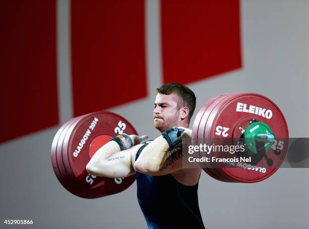 Peter Kirkbride of Scotland competes during the Men's 94kg Weightlifting Finals at Scottish Exhibition And Conference Centre during day six of the...
