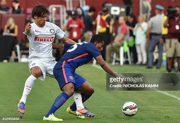 Inter Milan's Rene Krhin vies with Manchester United's Antonio Valencia during a Champions Cup match at FedEx Field in Landover, Maryland, on July...