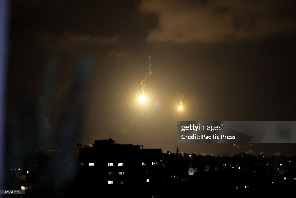 Israeli forces' flares, light up the night sky of Gaza City...