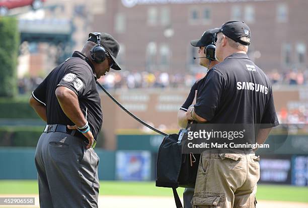 Major League Umpire Laz Diaz stands on the field for an instant replay review during the game between the Cleveland Indians and the Detroit Tigers at...