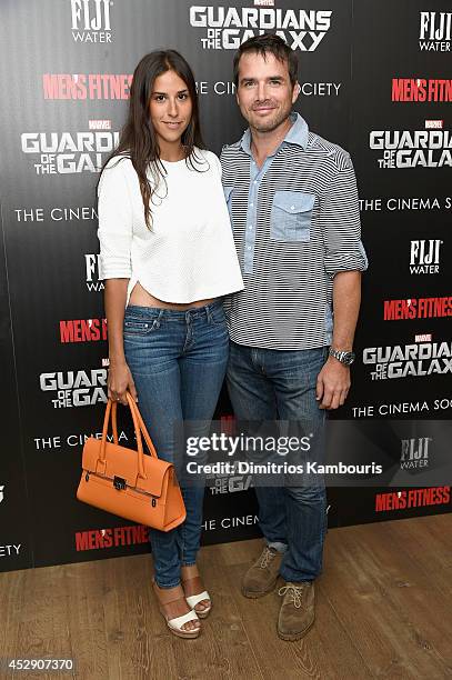 Maria Alfonsin and Matthew Settle attend The Cinema Society with Men's Fitness and FIJI Water special screening of Marvel's "Guardians of the Galaxy"...