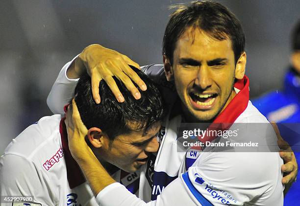 Players of Nacional celebrates qualifying to the final after losing a second leg semifinal match between Defensor Sporting and Nacional as part of...