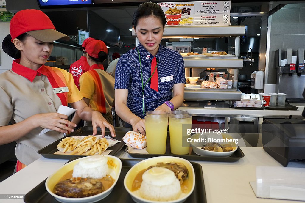 Jollibee CEO Ernesto Tanmantiong And Customers Inside A Jollibee Restaurant