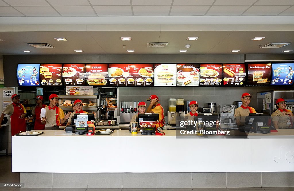 Jollibee CEO Ernesto Tanmantiong And Customers Inside A Jollibee Restaurant