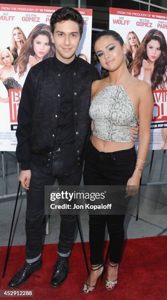 Actor Nat Wolff and actress Selena Gomez arrive at the Los Angeles Premiere "Behaving Badly" at ArcLight Hollywood on July 29, 2014 in Hollywood,...