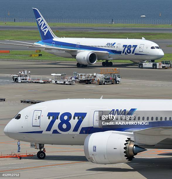 Dreamliner 787 passenger planes from Japan's All Nippon Airways are pictured on the tarmac at Tokyo's Haneda airport on July 30, 2014. All Nippon...