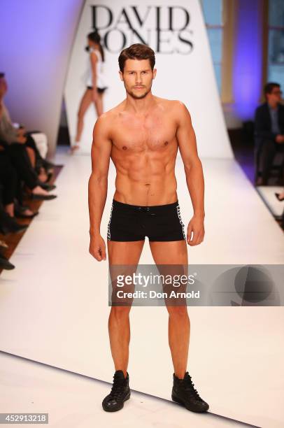 Jason Dundas showcases designs by Jets during a rehearsal ahead of the David Jones Spring/Summer 2014 Collection Launch at David Jones Elizabeth...