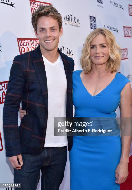 Actors Lachlan Buchanan and Elisabeth Shue arrive to the premiere of Mad Chance's "Behaving Badly" at the ArcLight Hollywood on July 29, 2014 in...