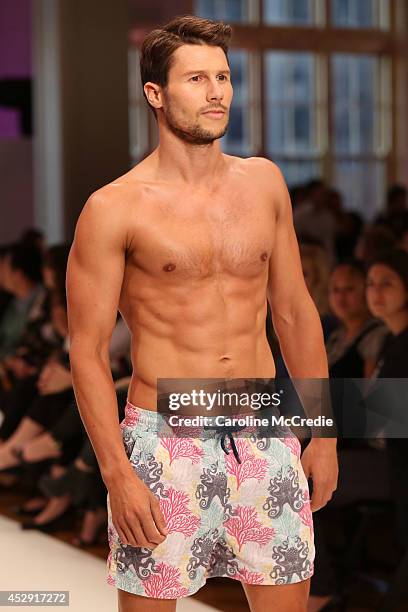 Model Jason Dundas showcases designs by The Rocks Push during a rehearsal ahead of the David Jones Spring/Summer 2014 Collection Launch at David...