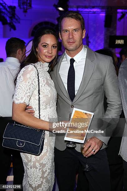 Tom Williams and Rachel Gilbert pose after the David Jones Spring/Summer 2014 Collection Launch at David Jones Elizabeth Street Store on July 30,...