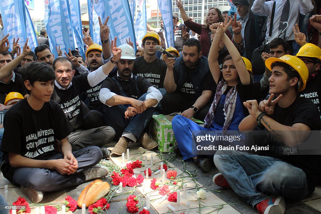 Demonstrators left flowers and release doves symbolizing the...