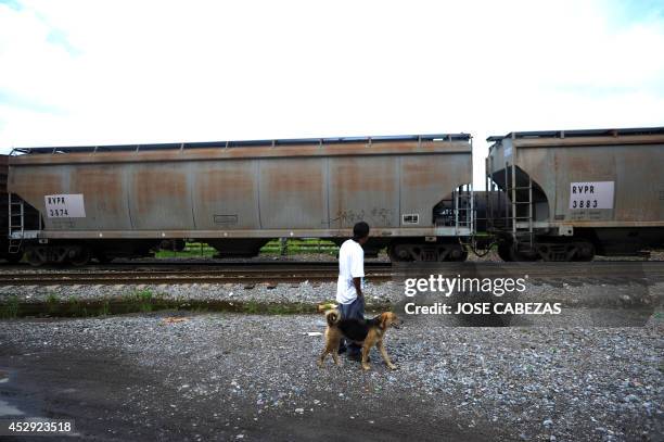 An immigrant walks along the railtracks in Tierra Blanca, Veracruz, Mexico, on August 21, 2010 waiting for a chance to board a train heading north....