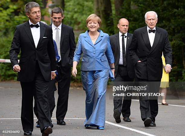 German Chancellor Angela Merkel , her husband Joachim Sauer , his son Daniel Sauer and former mayor of Hamburg, Klaus von Dohnanyi arrive for the...
