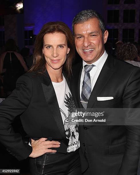 Rachel Griffiths and Paul Zahra pose after the David Jones Spring/Summer 2014 Collection Launch at David Jones Elizabeth Street Store on July 30,...