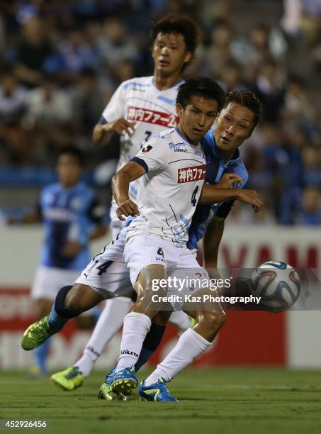 Yoshiro Abe of Jubilo Iwata and Keigo Numata of Kamatamare Sanuki compete for the ball during the J. League second division match between Jubilo...