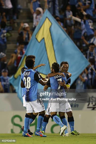 Yoshiro Abe of Jubilo Iwata celebrates scoirng his team's third goal with his teammates during the J. League second division match between Jubilo...