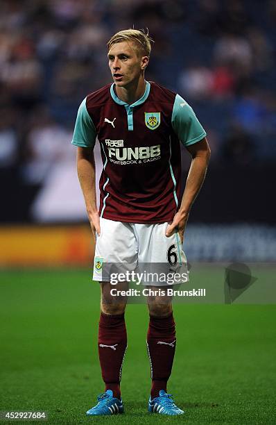 Ben Mee of Burnley in action during the pre season friendly match between Preston North End and Burnley at Deepdale on July 29, 2014 in Preston,...