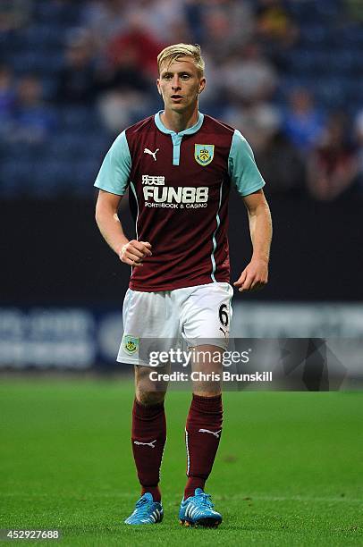 Ben Mee of Burnley in action during the pre season friendly match between Preston North End and Burnley at Deepdale on July 29, 2014 in Preston,...