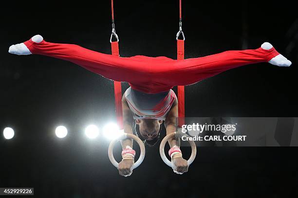 Ashish Kumar of India performs on the rings during the men's all round final of the Artistic Gymnastics event during the 2014 Commonwealth Games in...
