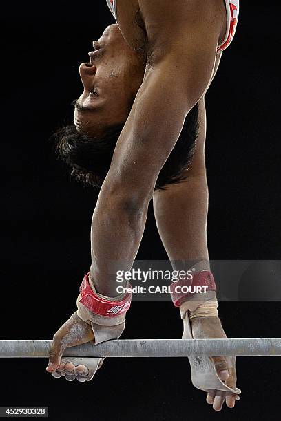 India's Ashish Kumar performs on the high bar during the men's all round final of the Artistic Gymnastics event during the 2014 Commonwealth Games in...