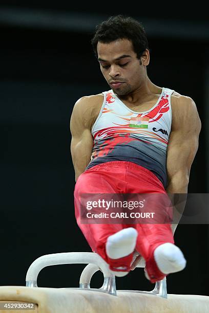 India's Ashish Kumar performs on the pommel horse during the men's all round final of the Artistic Gymnastics event during the 2014 Commonwealth...