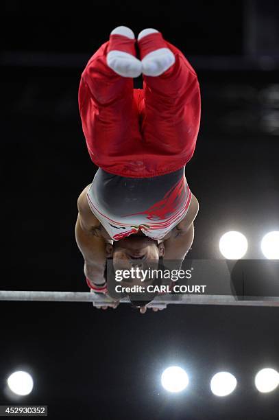 India's Ashish Kumar performs on the high bar during the men's all round final of the Artistic Gymnastics event during the 2014 Commonwealth Games in...