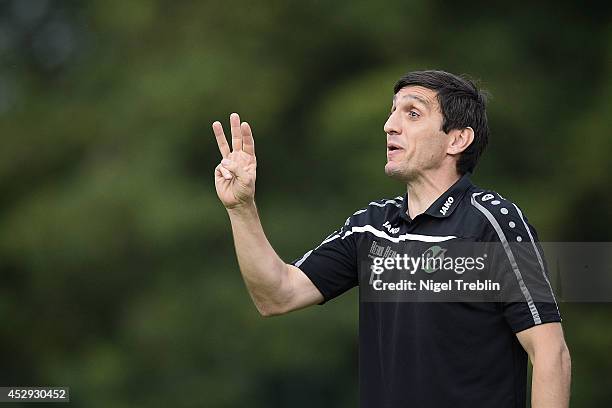 Head coach Tayfun Korkut of Hannover gestures during the Hannover 96 training camp on July 30, 2014 in Mureck, Austria.