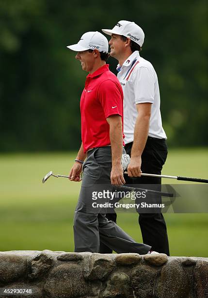 Rory McIlroy of Ireland and Keegan Bradley walk to the third green during a practice round for the World Golf Championships-Bridgestone Invitational...