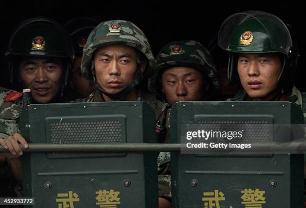 Chinese soldiers ride on the back of a truck as they patrol outside the Id Kah Mosque, China's largest, on July 31, 2014 in Kashgar, China. China has...