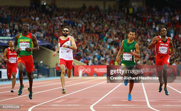 Kirani James of Grenada crosses the line to win gold ahead of Martyn Rooney of England, Wayde van Niekerk of South Africa and Lalonde Gordon of...