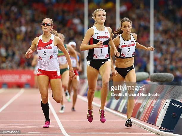 Jessica Tappin of England, Gold medalist Brianne Theisen-Eaton of Canada and silver medalist Jessica Zelinka of Canada sprint to the finish line in...