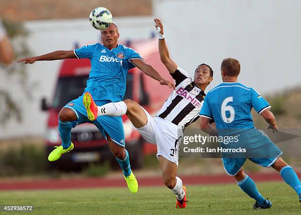 Wes Brown of Sunderland clears ahead of Suk of CD National during a pre-season friendly match between CD National and Sunderland at the Estadio...