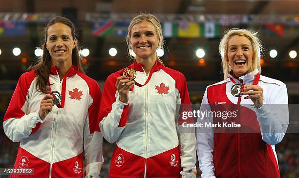 Silver medallist Jessica Zelinka of Canada, gold medallist Brianne Theisen-Eaton of Canada and bronze medallist Jessica Taylor of England pose on the...