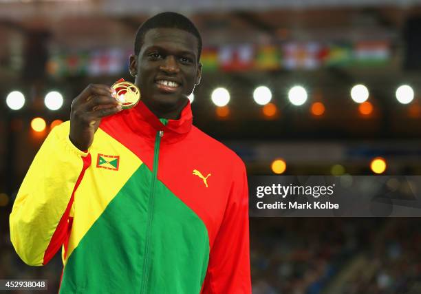 Gold medallist Kirani James of Grenada aon the podium during the medal ceremony for the Mens 400 metres at Hampden Park during day seven of the...