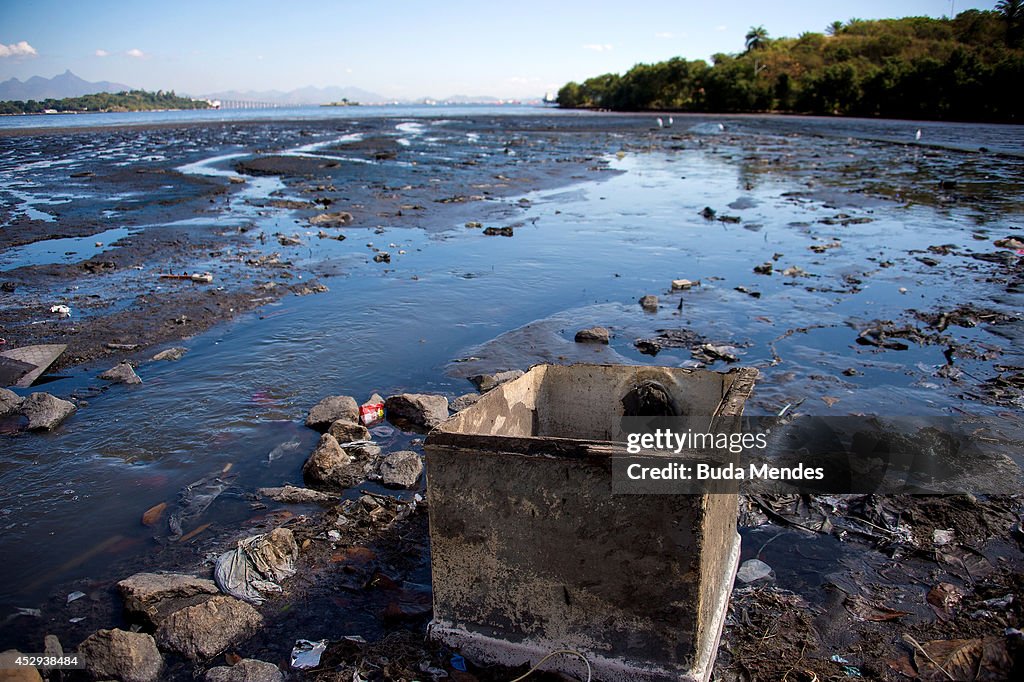 Water Pollution Rio Debris sits near the shoreline of the polluted waters of Guanabara ...