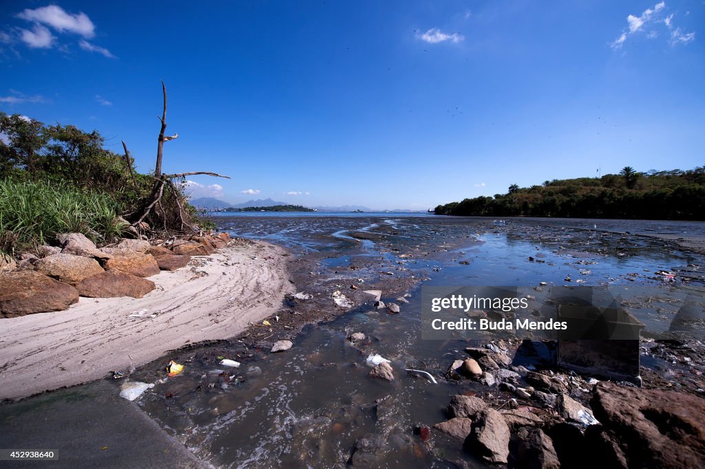 Water Pollution Rio Debris sits near the shoreline of the polluted waters of Guanabara ...