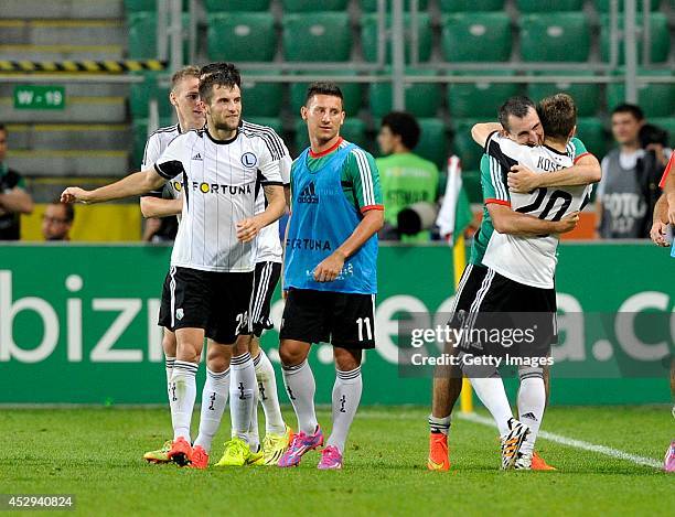 Jakub Kosecki of Legia celebrates after scoring with team mates during the third qualifying round UEFA Champions League match between Legia and...