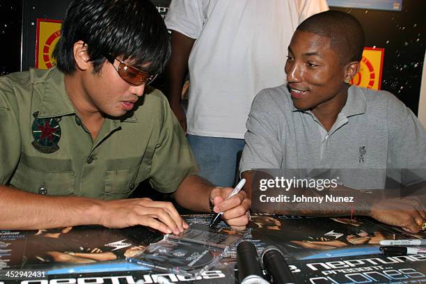 Neptunes' Chad Hugo and Pharrell Williams during Neptunes Present...Clones Album Signing in New York City on August 19, 2003 at Tower Records,...