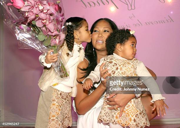 Ming, Kimora, and Aoki Lee Simmons during Olympus Fashion Week Fall 2004 - Baby Phat - Front Row and Backstage at Gotham Hall in New York City, New...
