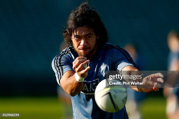 Steven Luatua of the All Blacks passes during a New Zealand All Blacks training session at North Harbour Stadium on July 31, 2014 in Auckland, New...