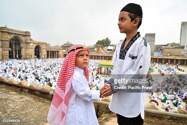 Two boys celebrate Eid. Eid al-Fitr is the end of Ramazan and the first day of the month of Shawwal for all Muslims in Jama Masjid, Ahmedabad.