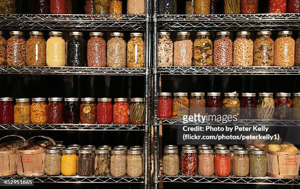 mason jars with pickles, preserves and food stuffs - メイソンジャー ストックフォトと画像