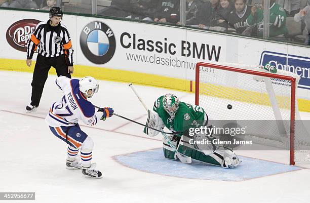 David Perron of the Edmonton Oilers nets a shootout goal against Kari Lehtonen of the Dallas Stars at the American Airlines Center on December 1,...