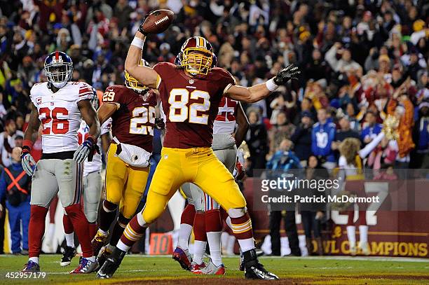 Logan Paulsen of the Washington Redskins celebrates after scoring a touchdown in the second quarter of an NFL game against the New York Giants at...
