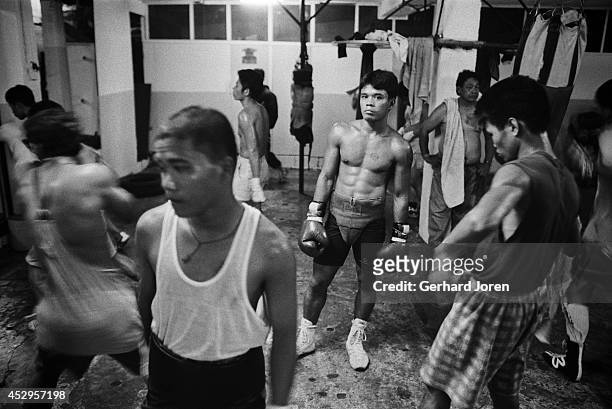 Boxers training at LM Gym in Manila where boxing sensation Manny Pacquiao started his career at the age of 17. Manny ran away from his impoverished...