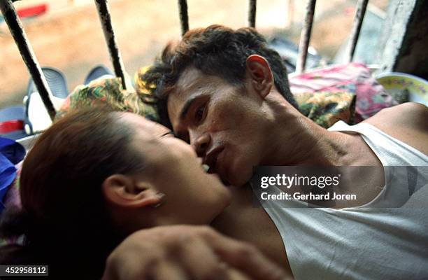 Married couple trying to get some private time during visiting hours at Batang City Jail, one of four gangs in the Manila City Jail. Some of the...