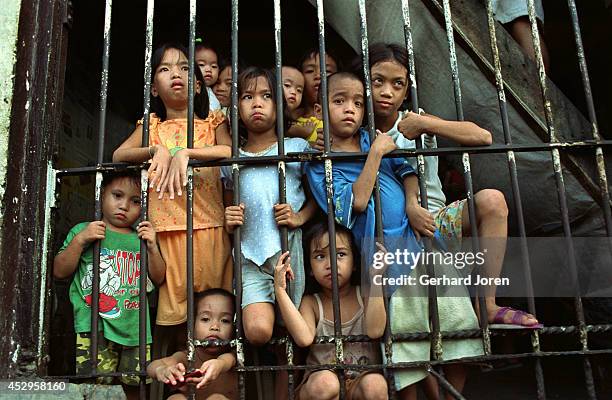 Children during visiting hours at Batang City Jail, one of four gangs at the Manila City Jail. Some of the children even live with their fathers in a...