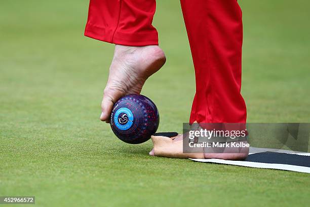 Bob Love of England prepares to bowl in the bronze medal Para-Sport Open Triples B6/B7/B8 lawn bowls match between England and Scotland at...